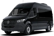 Modern black sprinter van designed for group travel with ample seating and headroom.